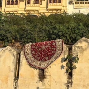 Round hand knotted red floral rug by The Taj Rugs