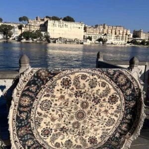 Round hand knotted floral wool rug by The Taj Rugs