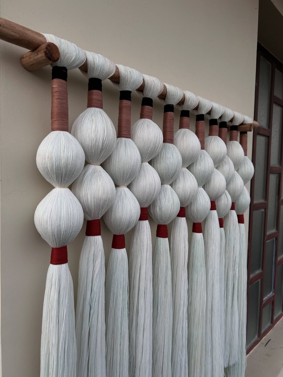 Luxury beaded macrame wall hanging with wooden rod in Udaipur